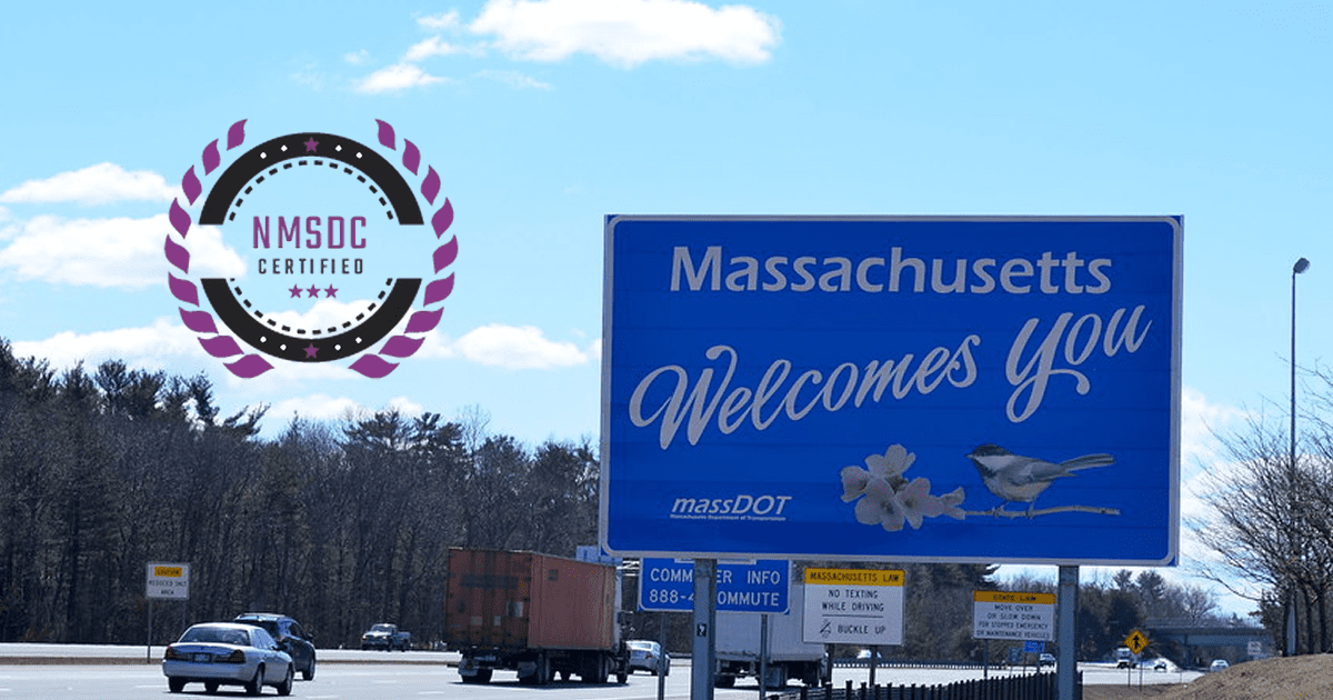 A blue sign that says massachusetts welcomes you on it