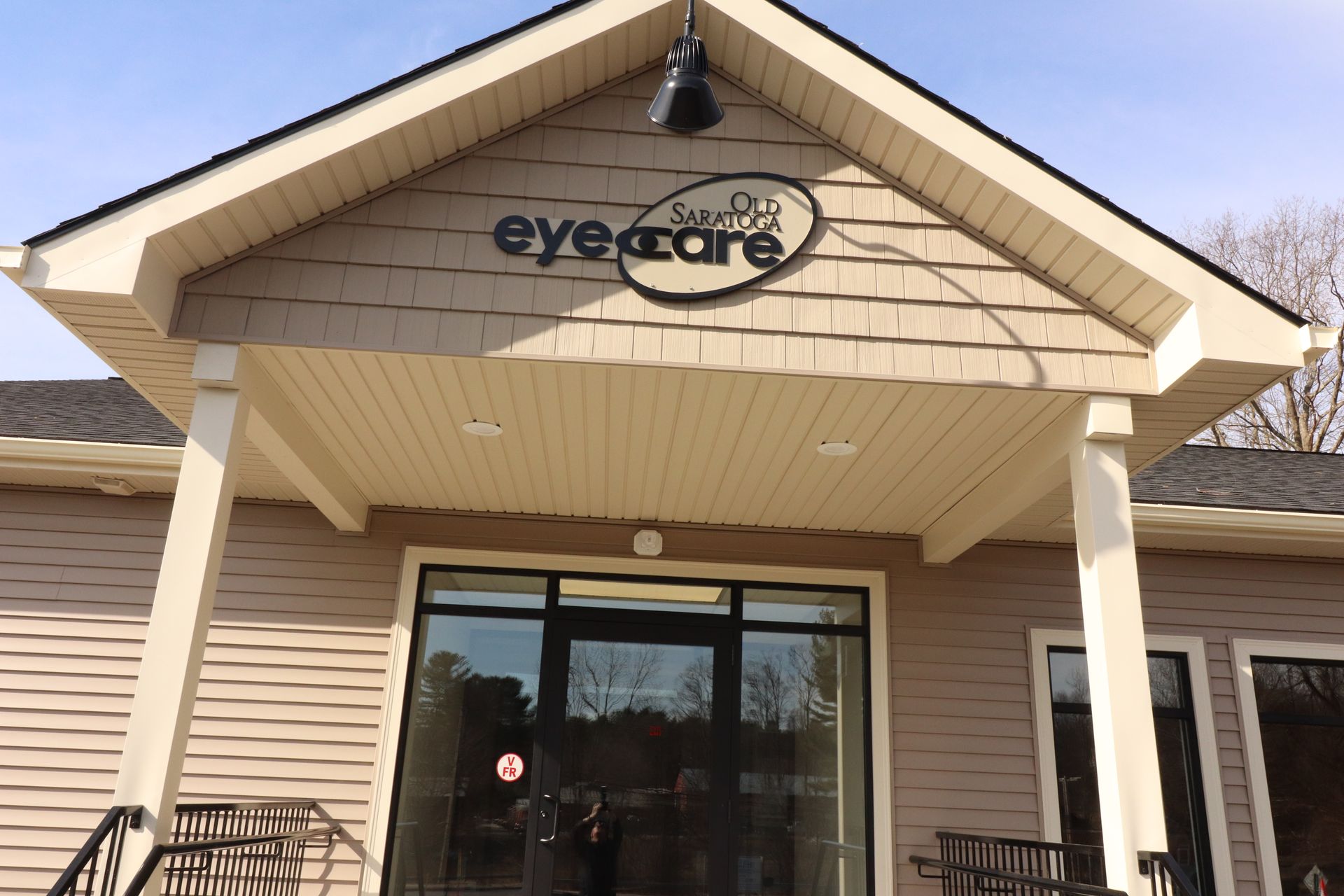 A building with a sign that says eye care on it