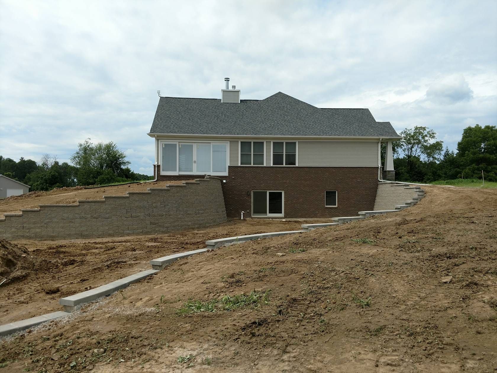 A residential home showing quality landscaping construction service.