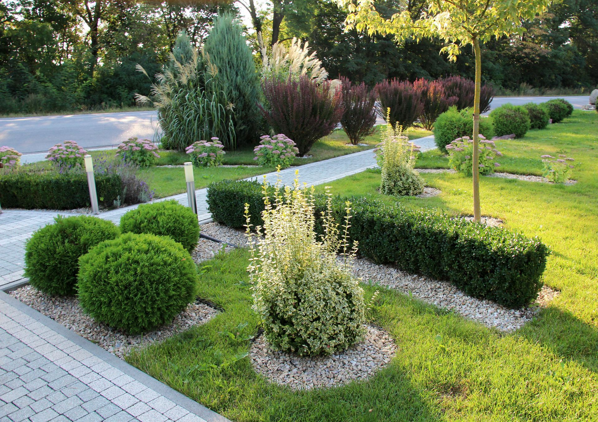 Garden with trimmed bushes and trees | Landscaping services in Rochester, MI