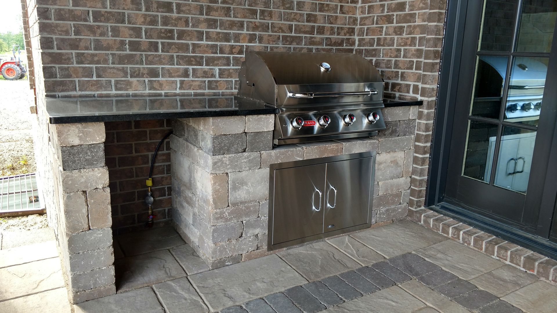 Outdoor kitchen and grilling station installation service.