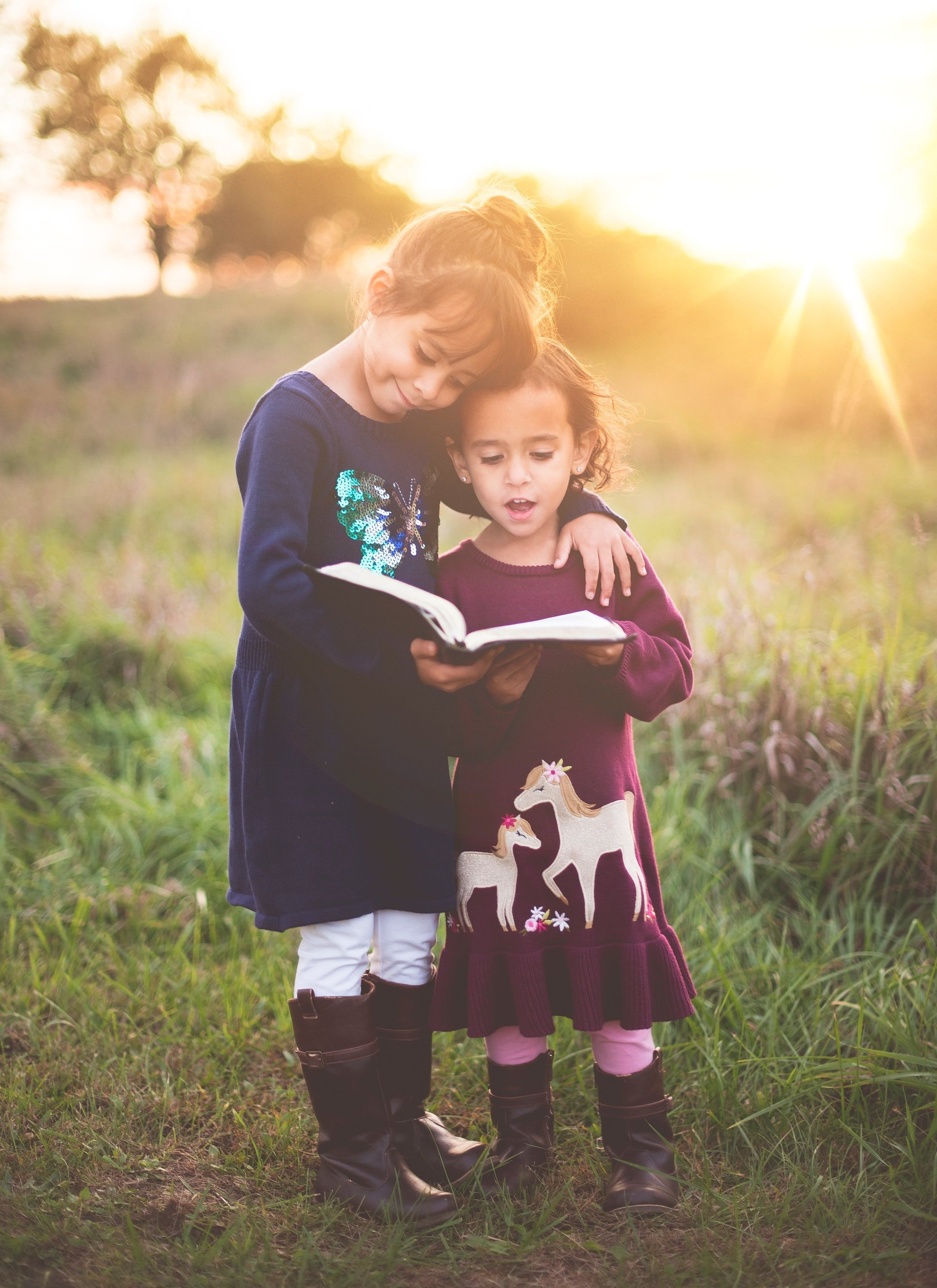 Image of Two Girls Reading Outside
