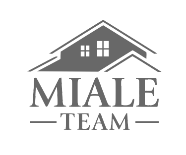 Gray MIALE TEAM logo with a house roof and windows above the text