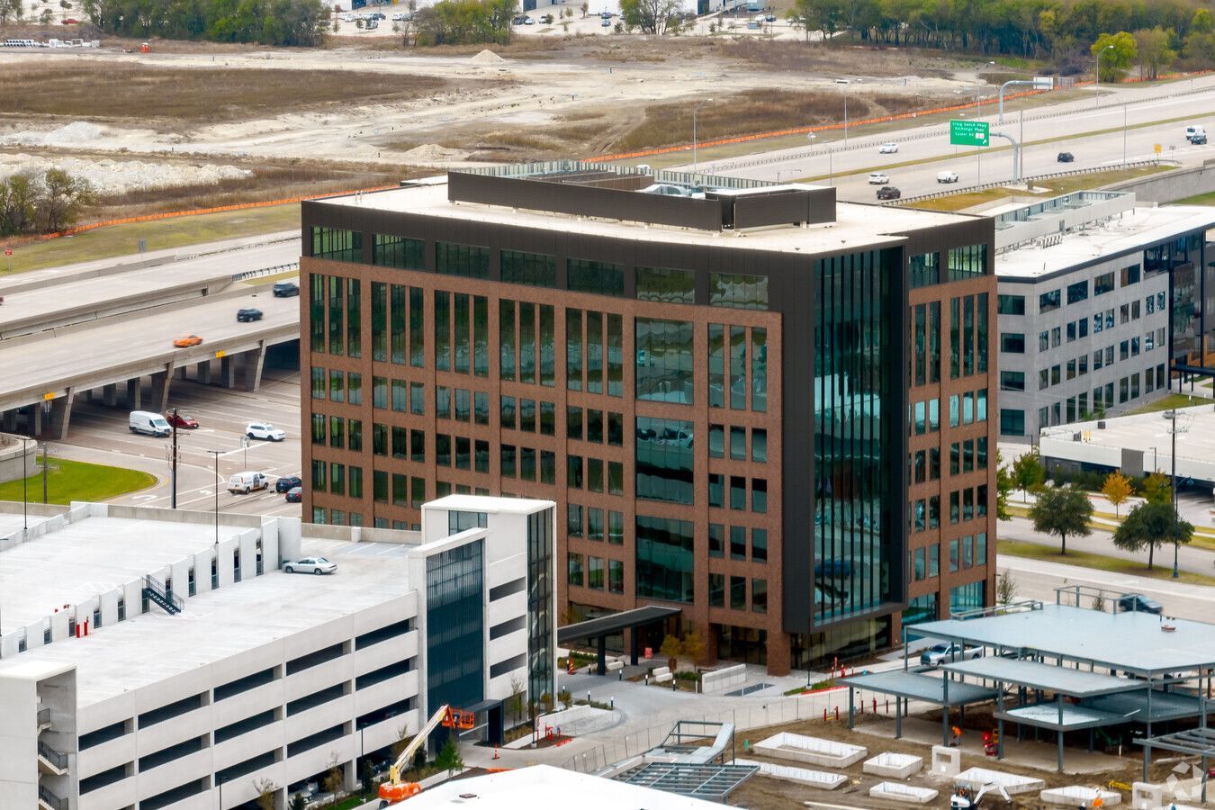 An aerial view of a large building in the middle of a city.