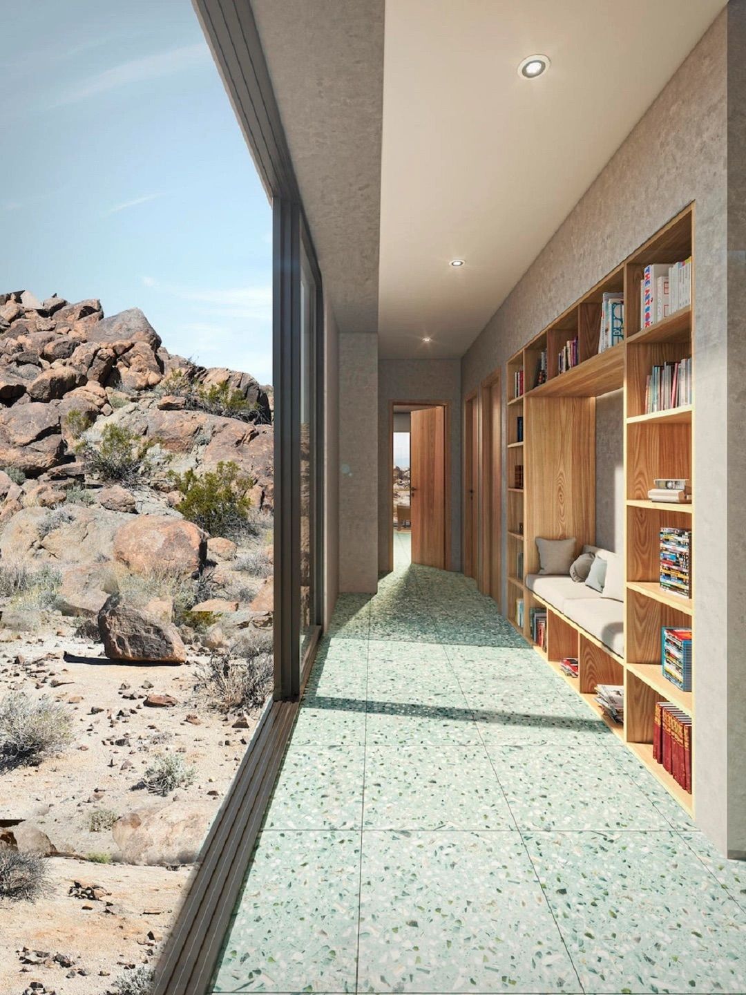 Hallway with built-in bookshelves and seating, large window showcasing a desert landscape. Blue-green tiled floor.