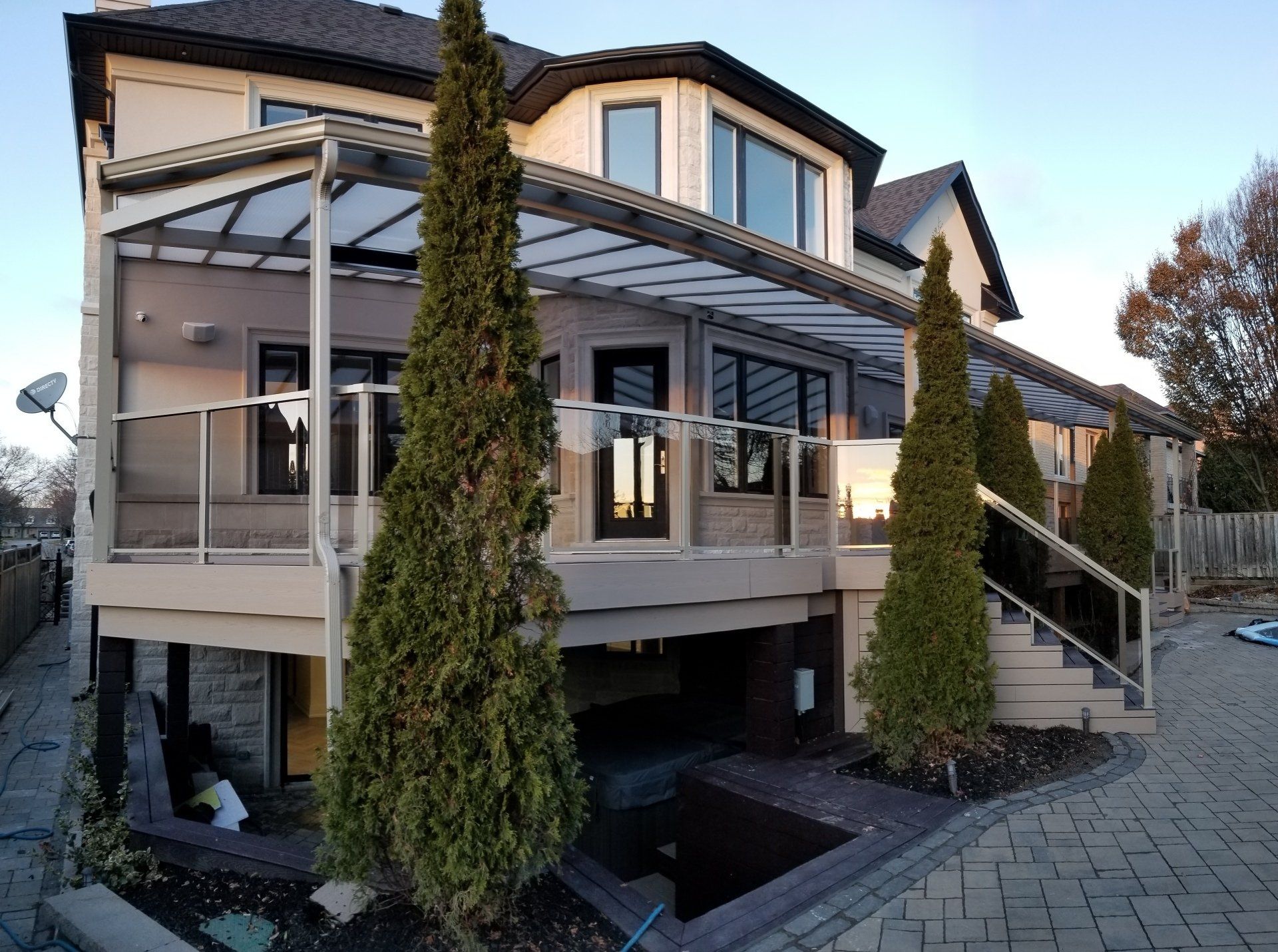 A large house with a large deck and stairs