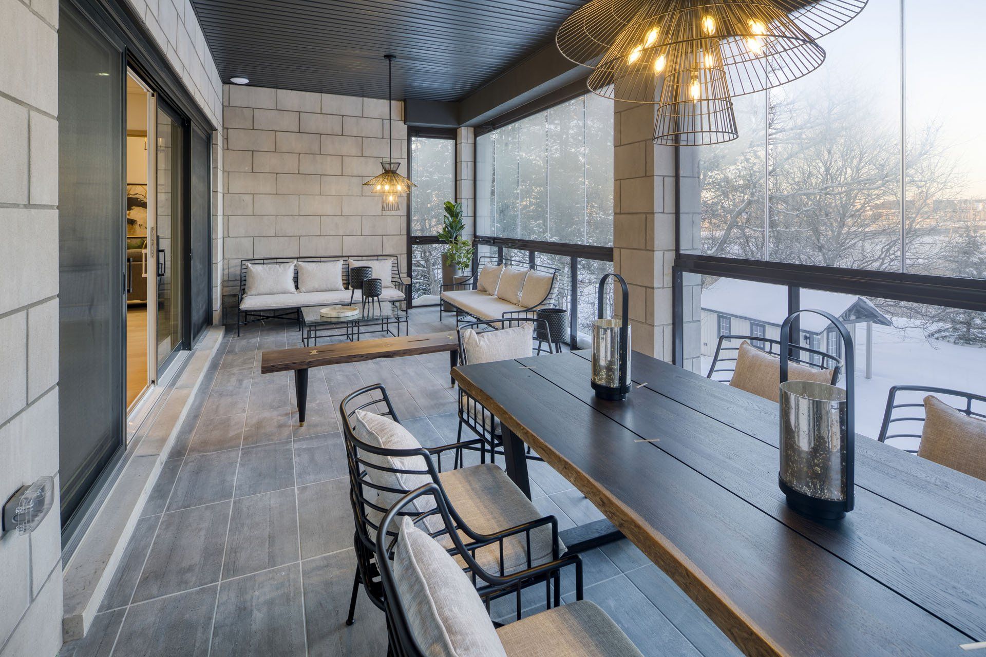 There is a large table and chairs on the balcony.
