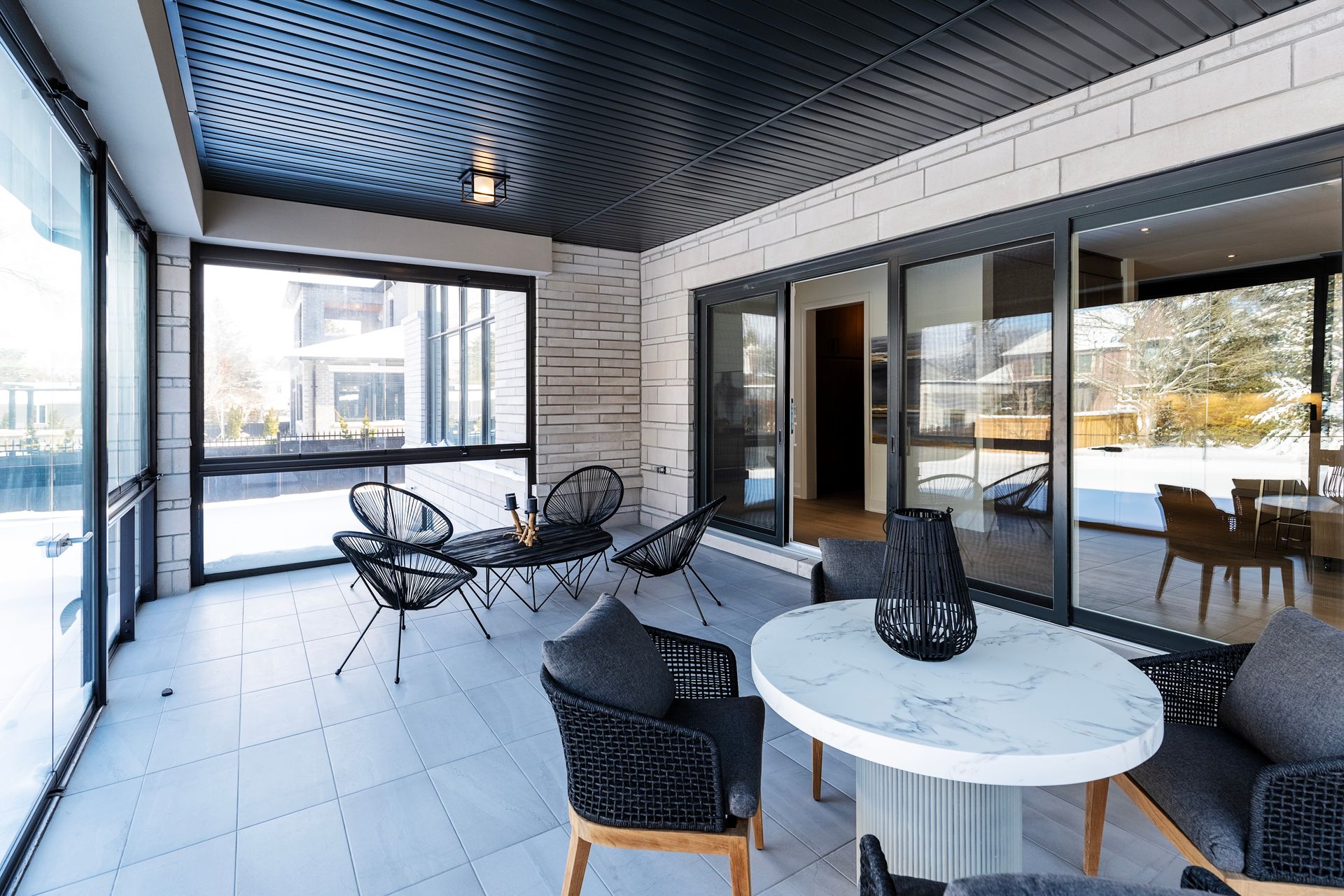 A large room with a table and chairs in it.