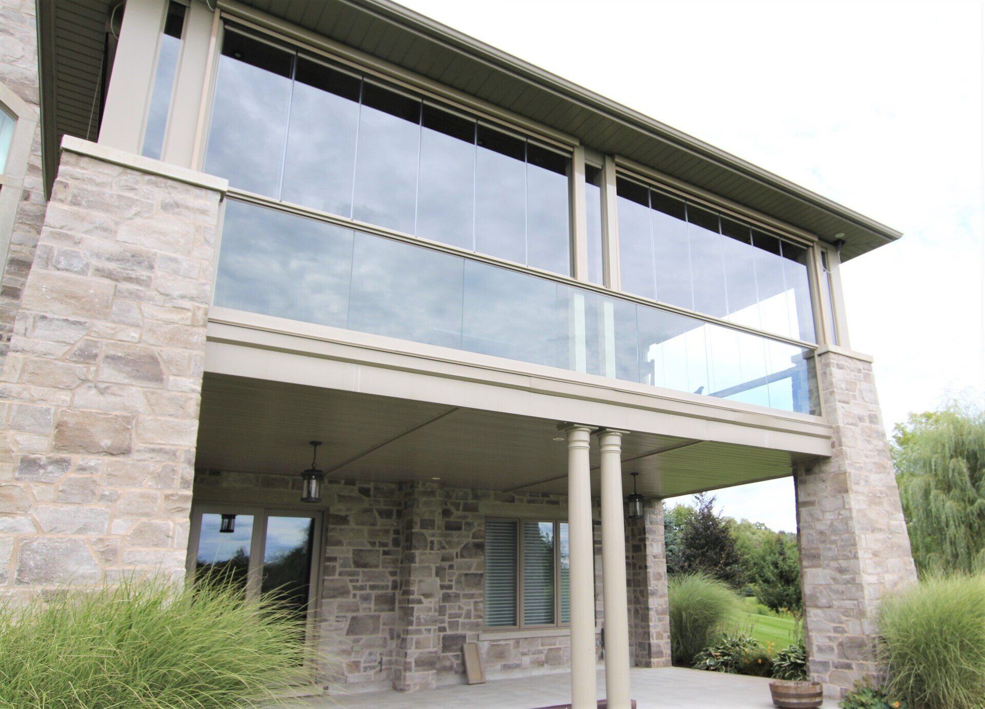 A large house with a balcony and lots of windows