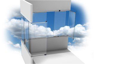 A sliding glass door with a blue sky in the background.