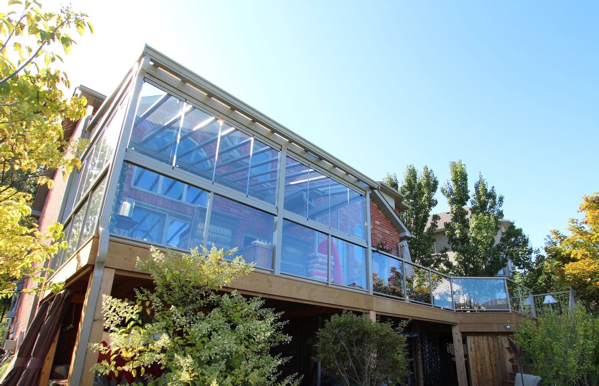A house with a large deck and lots of windows