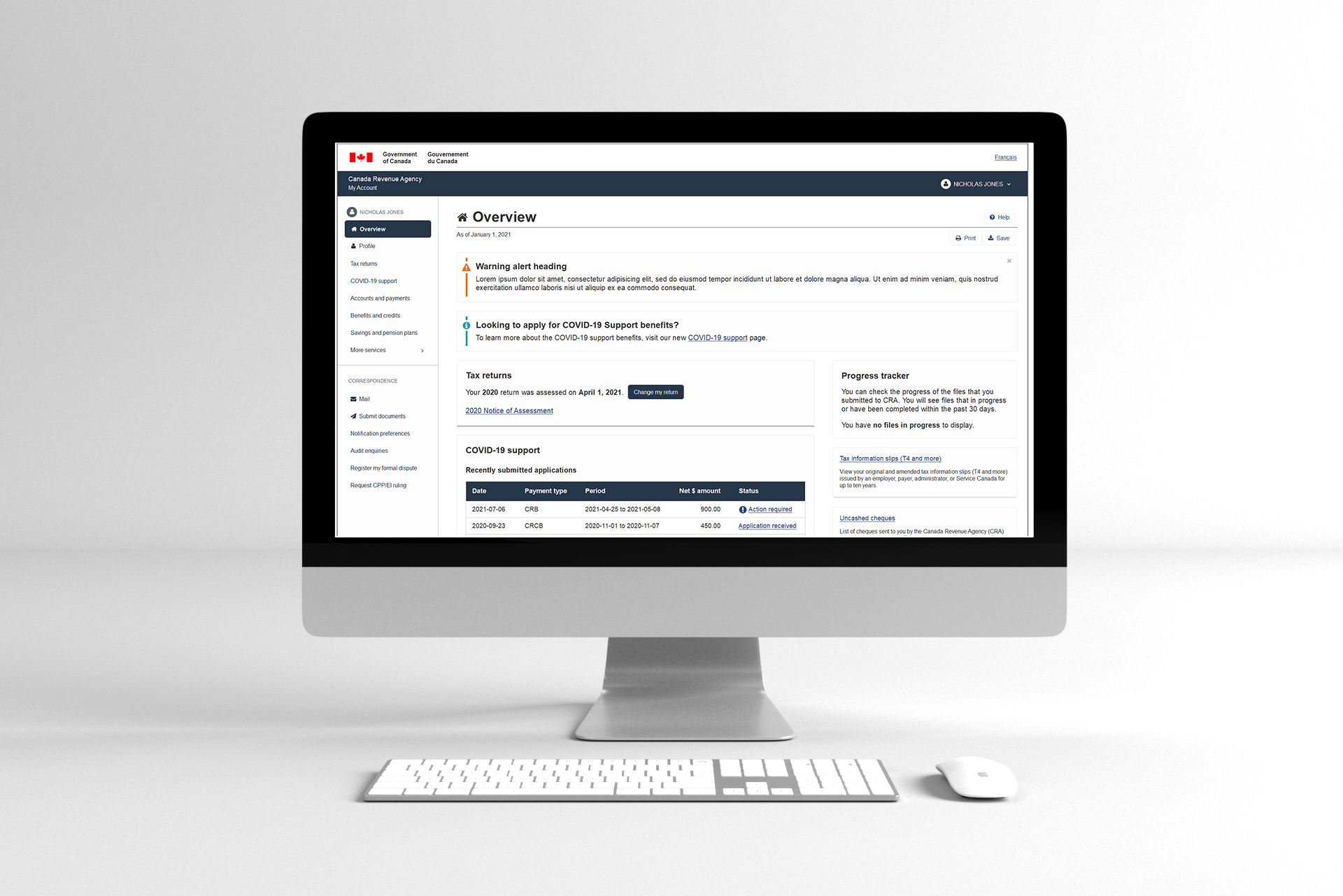 Desktop monitor displaying a CRA Canada Revenue Agency website interface on a white desk with keyboard and mouse