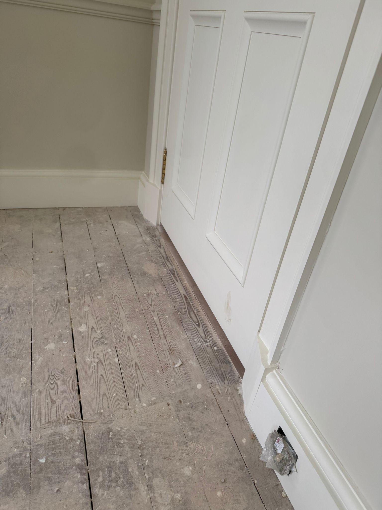 White customized curved wood on a doorway.