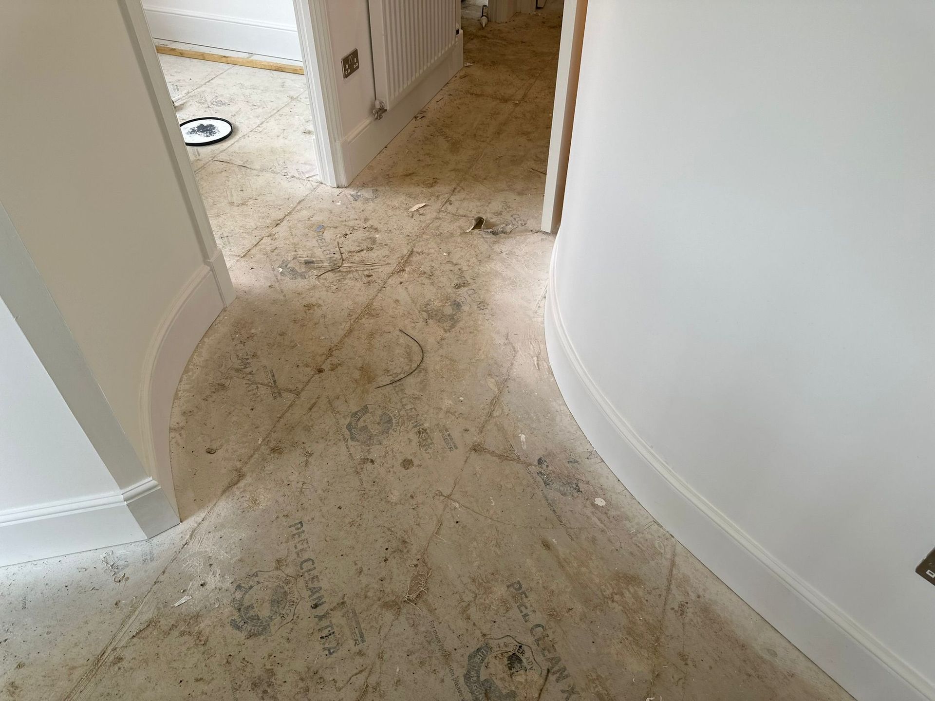 White customized curved wood on a doorway.