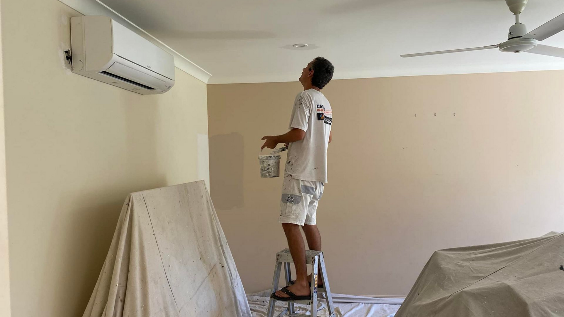 A Man Preparing The Home Before Painting