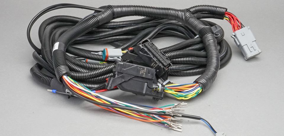 Mobile vehicle wire harnesses, cable harnesses and electrical enclosure assemblies. 2