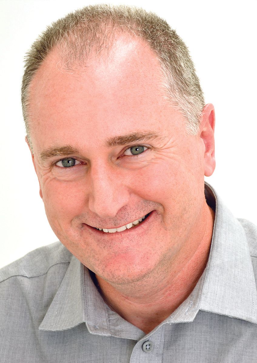 headshot of professional middle aged man smiling