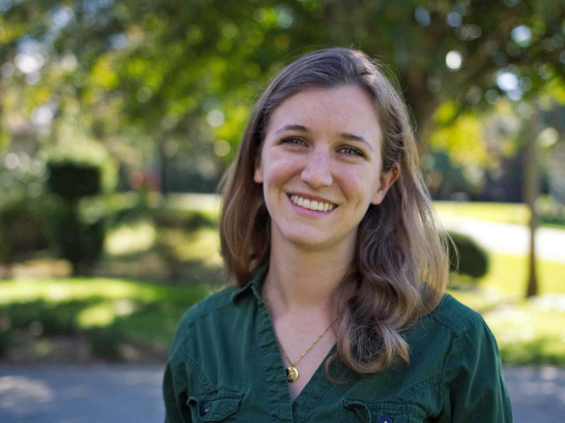 Erika in a green shirt is smiling