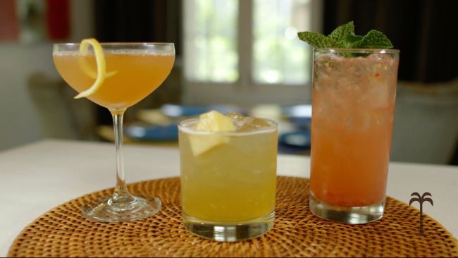 Three different types of drinks are sitting on a table.