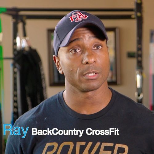 A man wearing a black shirt that says ray backcountry crossfit
