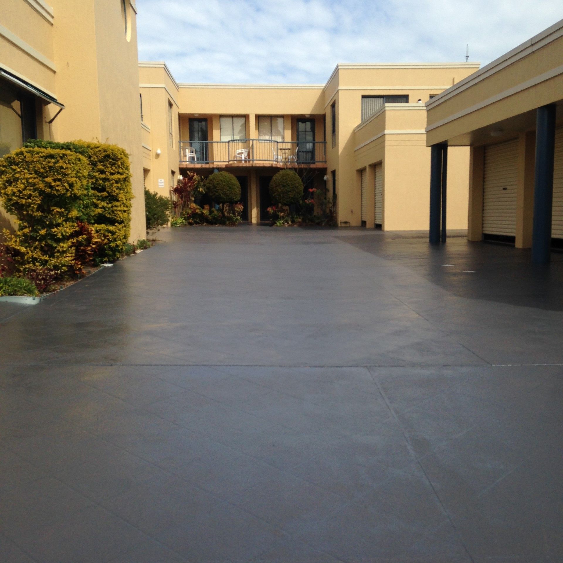 Using Roller Brush in Applying Sealant — Complete Pressure Cleaning in Glen Port Macquarie, NSW