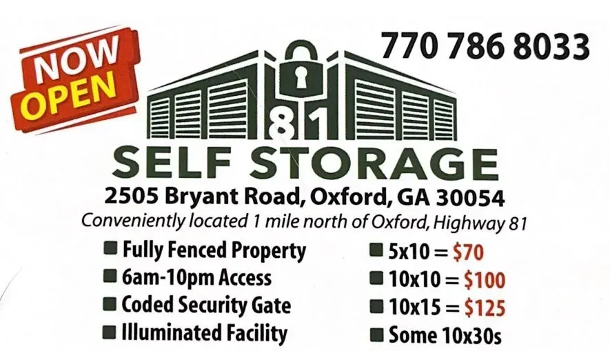 A sign for self storage says it is now open