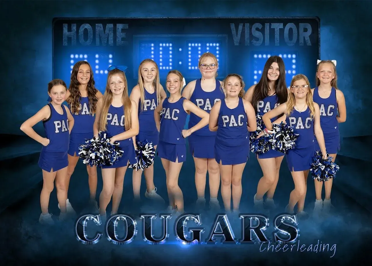 A group of cheerleaders for the cougars are posing for a picture