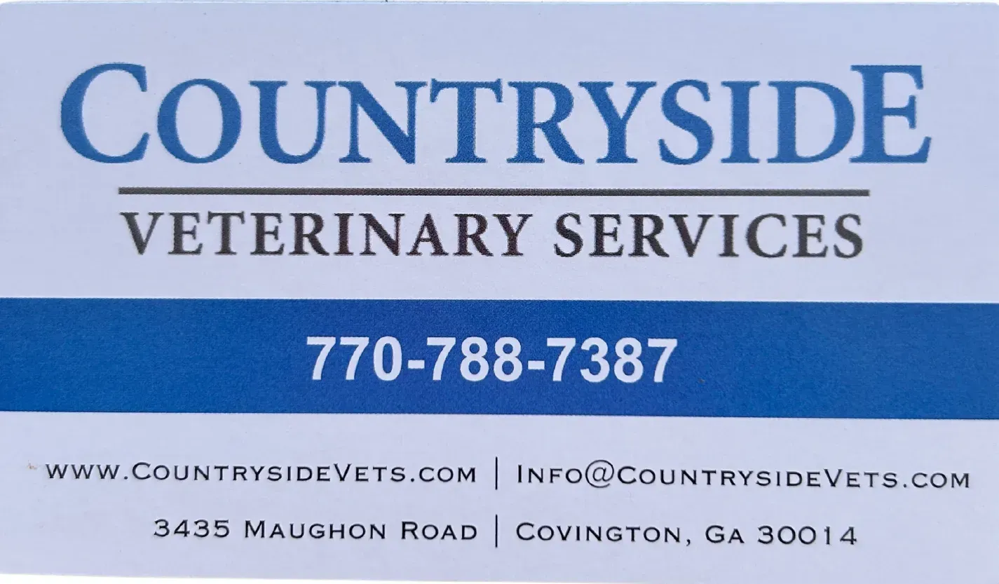 A blue and white sign for countryside veterinary services