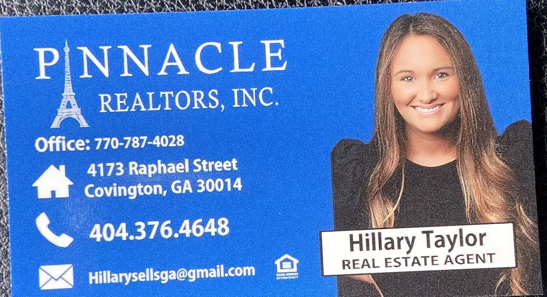 A business card for pinnacle realtors inc.