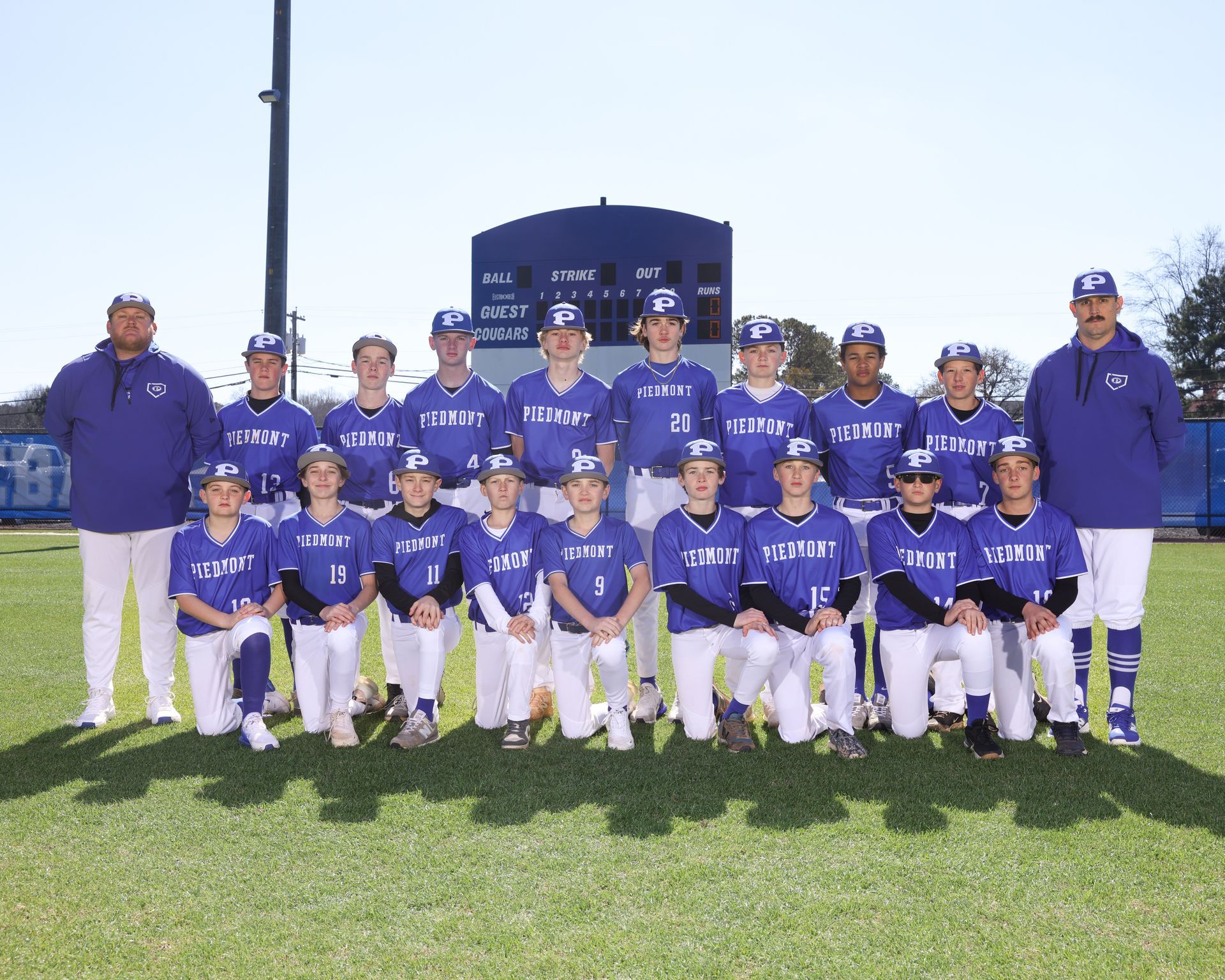 The piedmont academy cougars baseball team is posing for a team photo.