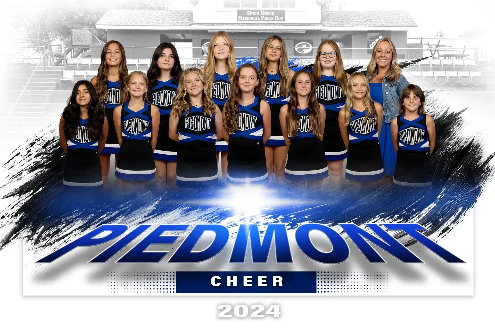A group of cheerleaders are posing for a picture.