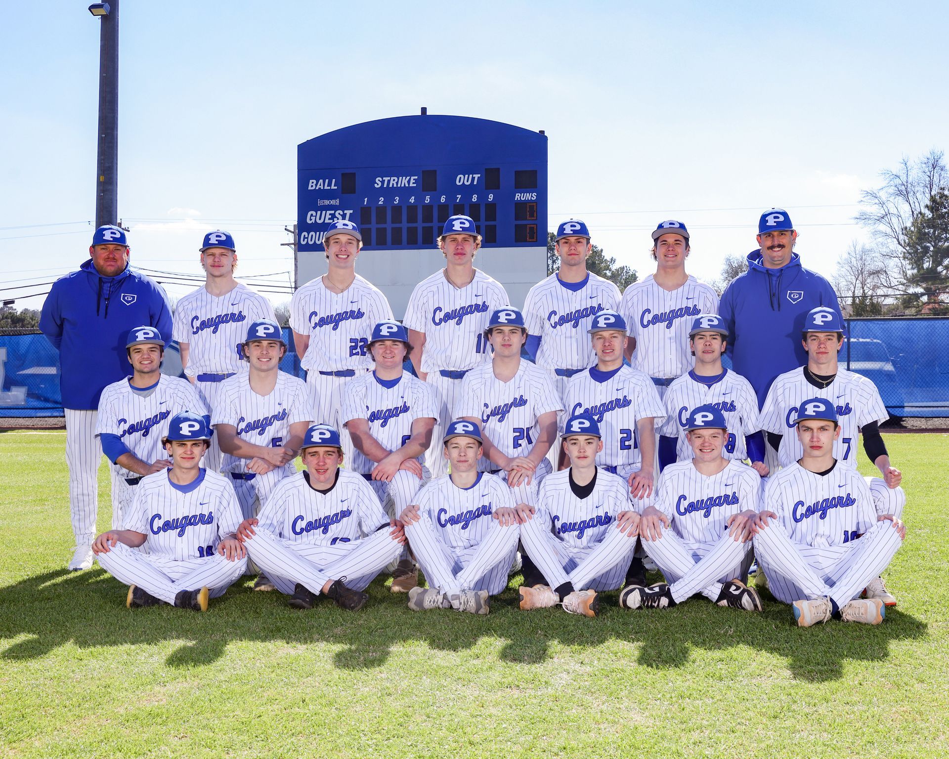 The piedmont academy cougars baseball team is posing for a team photo.