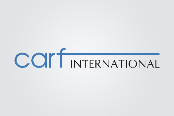 The logo for carf international is blue and black on a white background