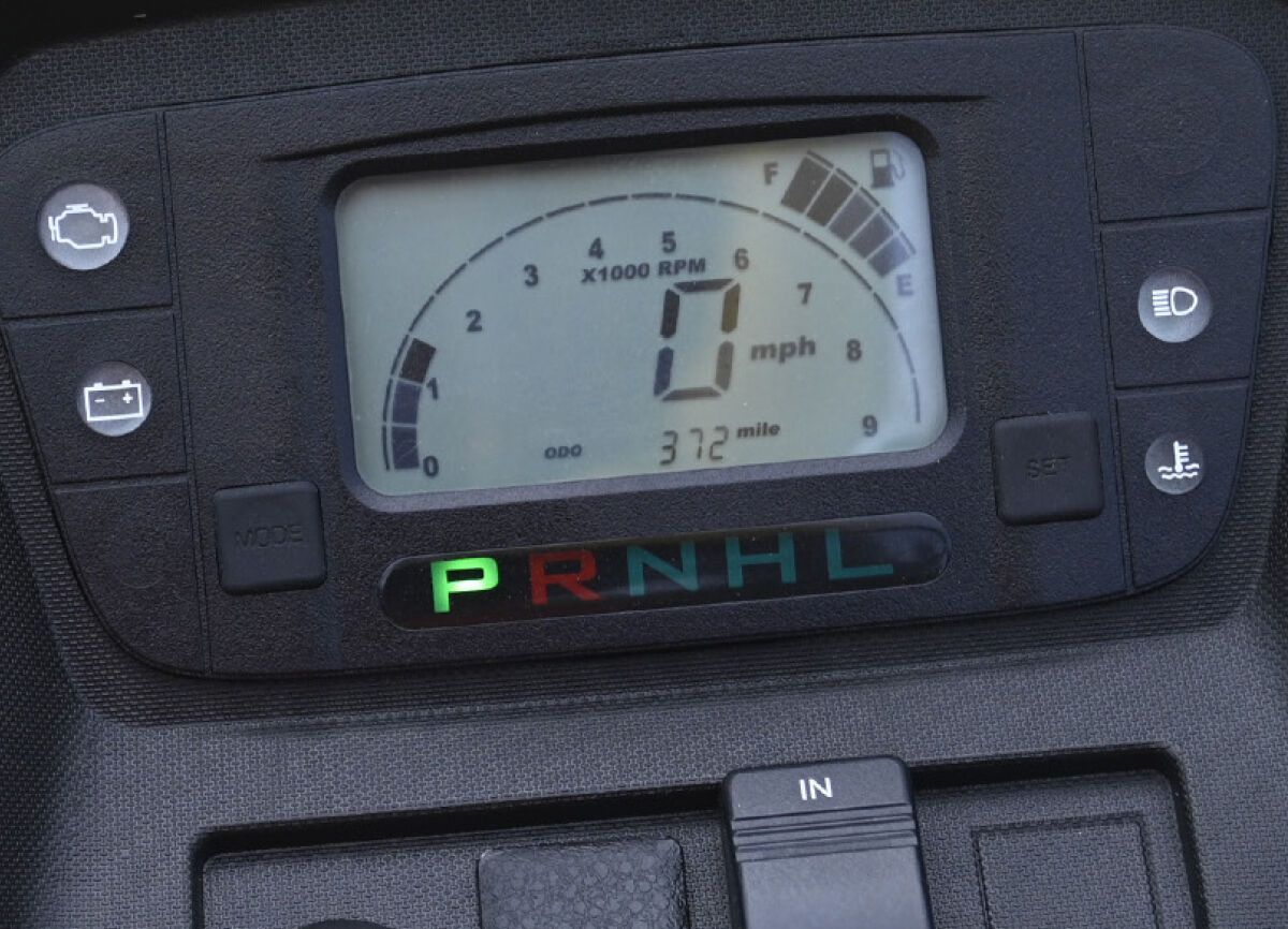 A dashboard with a speedometer that says ' prnhl ' on it