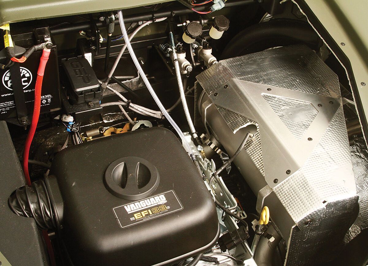 a vanguard engine sits underneath the hood of an XTV