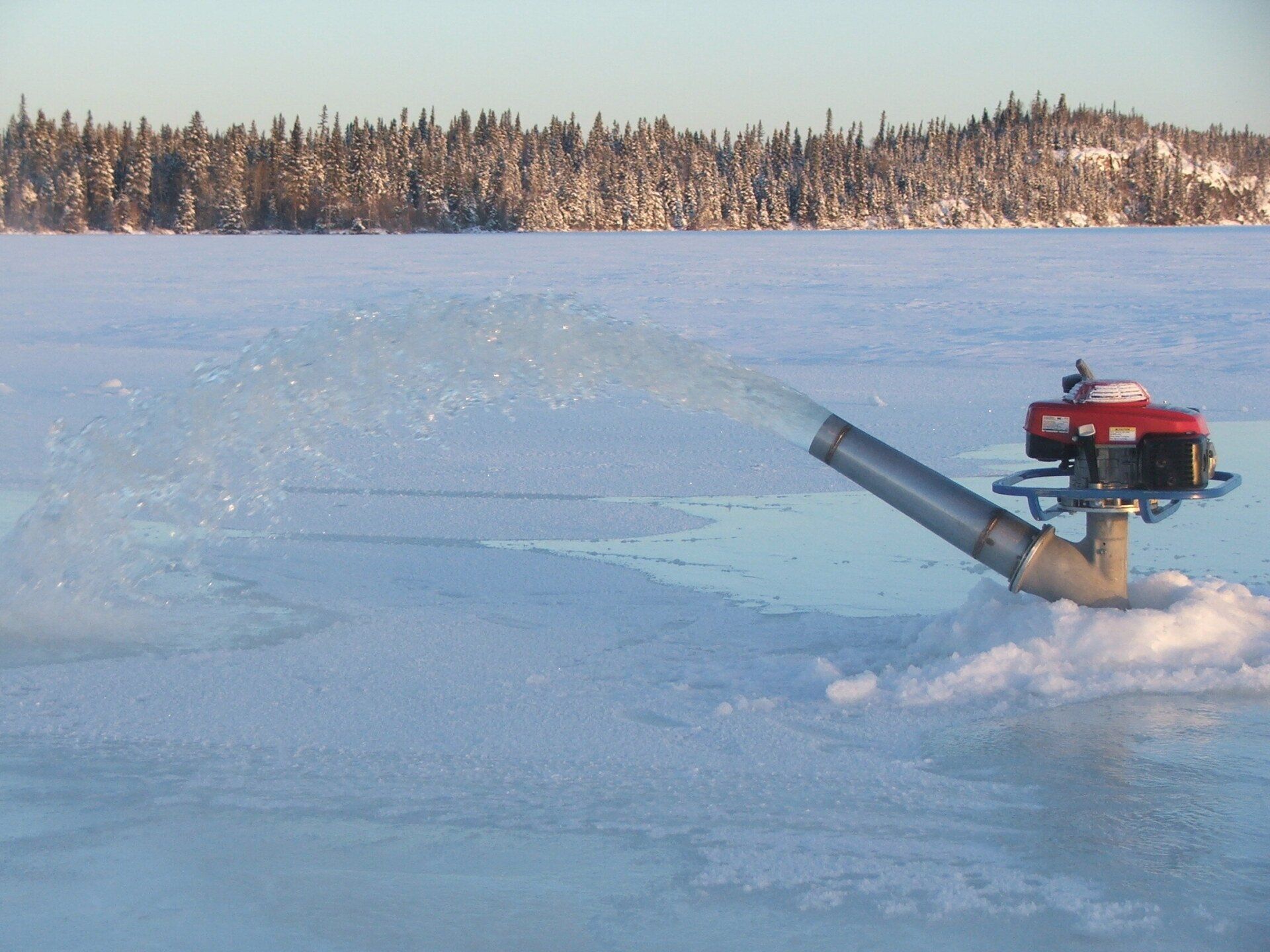 The Big ice B-55 Flood Pump for thickening winter ice roads, river crossings, exploration drill pad.