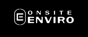 A group of people are standing around a whiteboard.