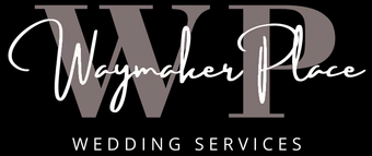 A group of people are sitting at a table looking at a tablet.