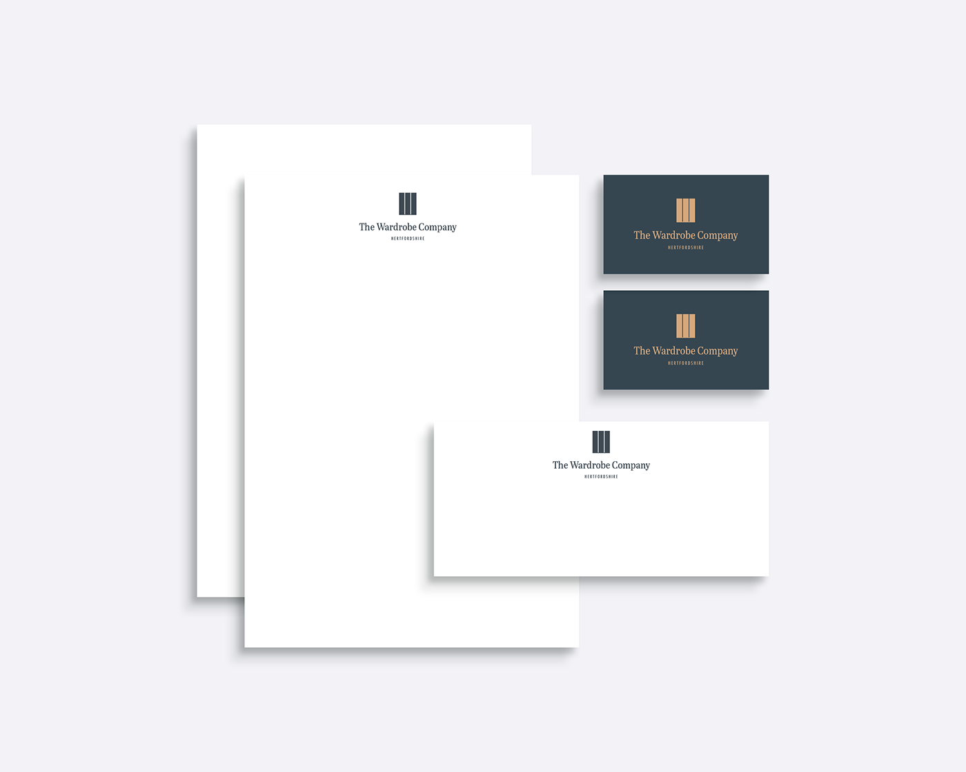 A mockup of a business card , letterhead , and envelope.