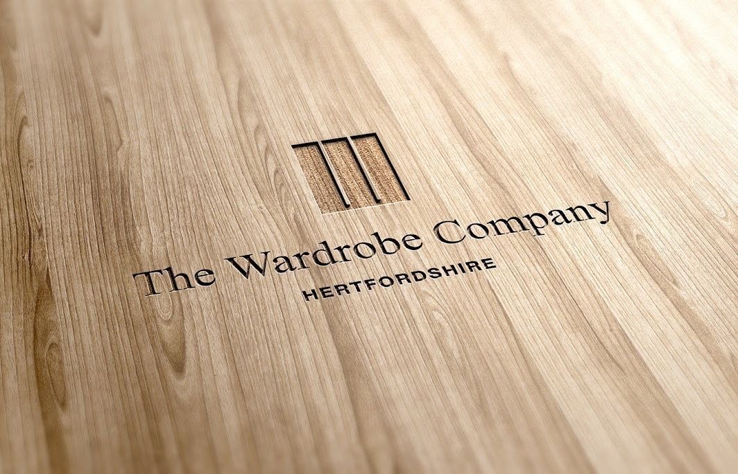 A wooden box with the words the wardrobe company engraved on it