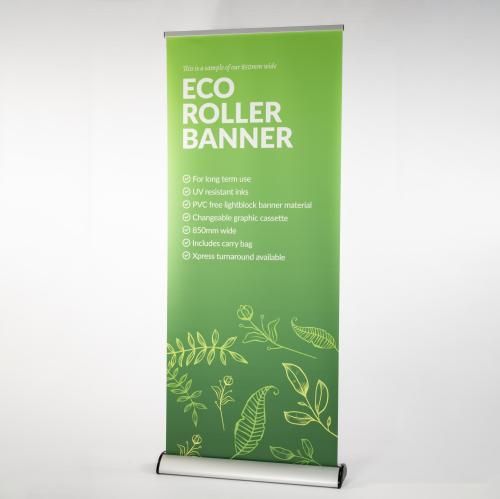 A green eco roller banner is sitting on a white surface.