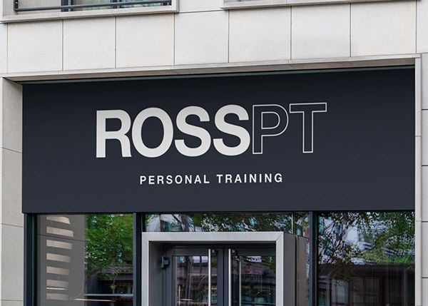 A sign for rosspt personal training is above the door