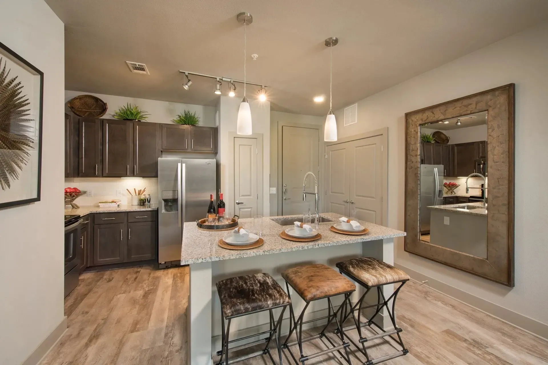 Modern kitchen with granite counter and bar seating