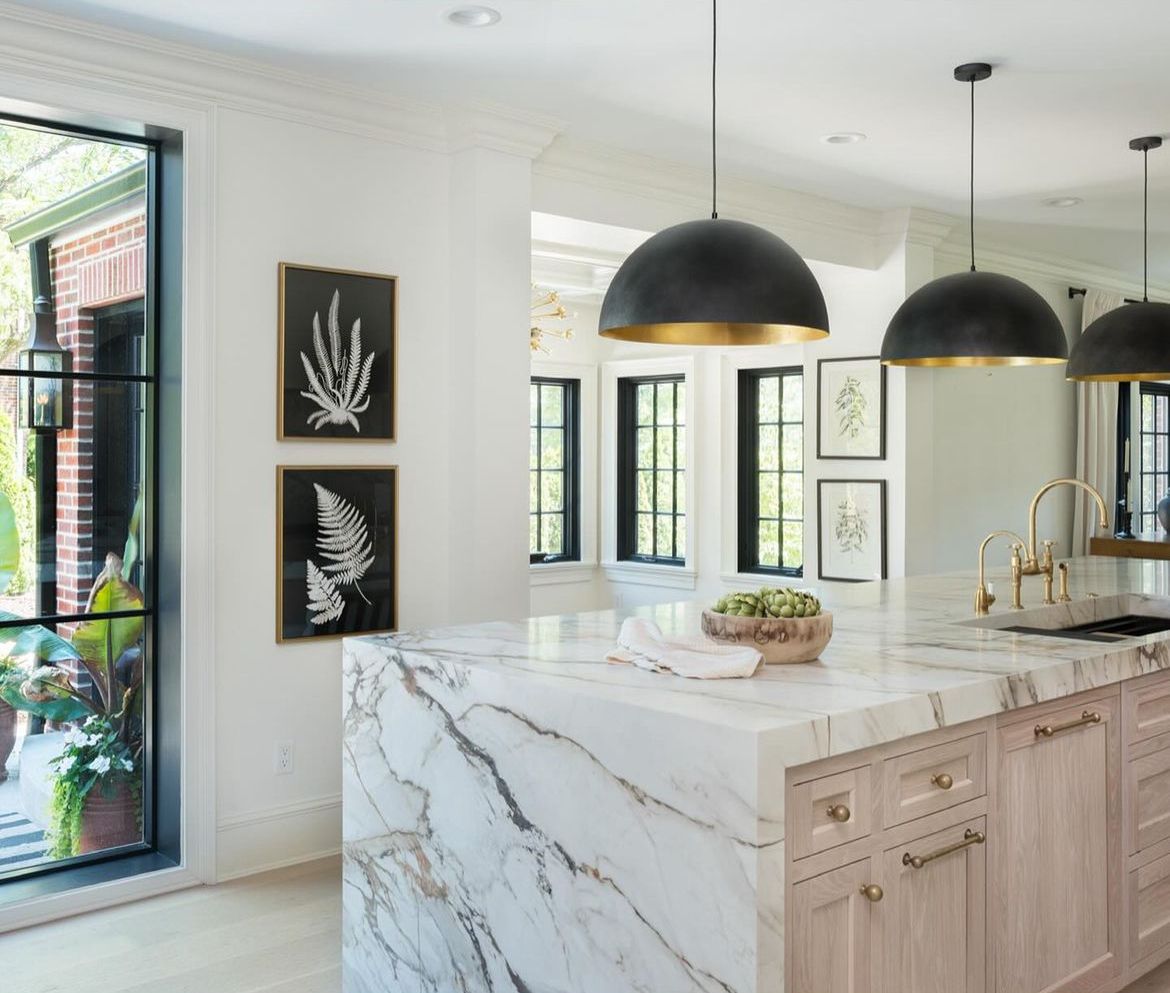 There is a large island in the middle of the kitchen.