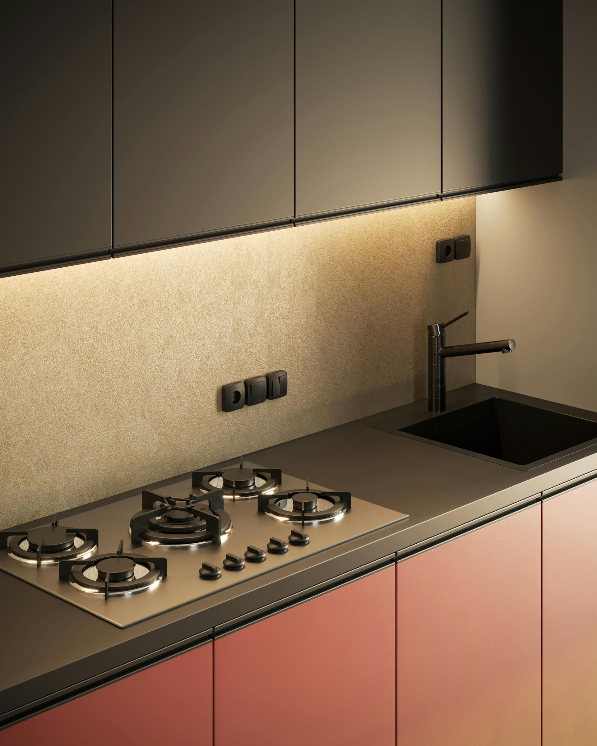 Modern kitchen with black upper cabinets, red lower cabinets, cooktop, and sink.