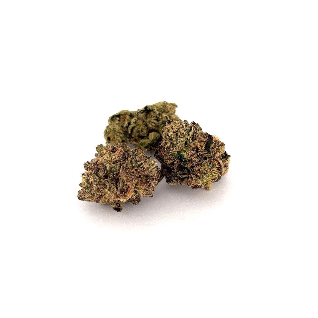 Three cannabis buds on a white background. Dark green and brown buds.