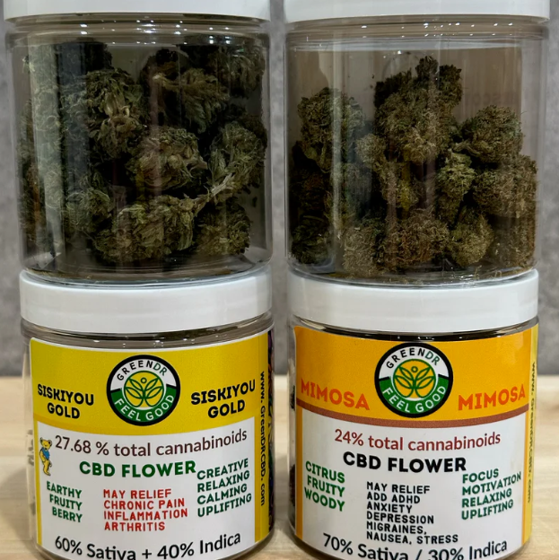 Two jars of cannabis flower, one