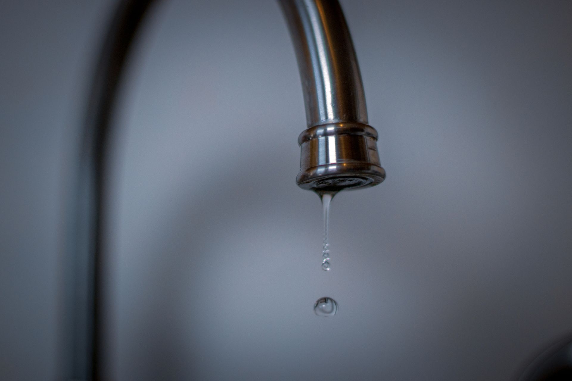 A Close up Of a Faucet with Water Dripping from It | Neenah, WI | Ogden Plumbing