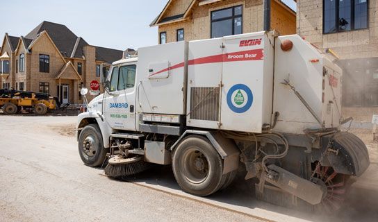 Road Sweeping Truck Clearing Street