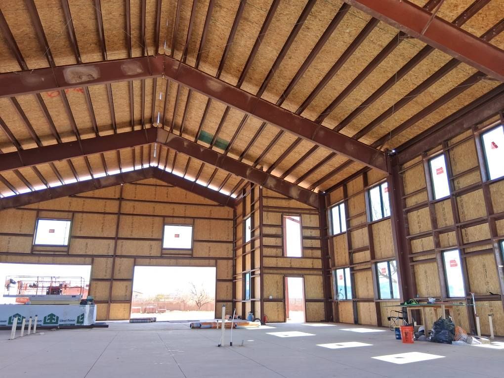 A large building under construction with a lot of windows
